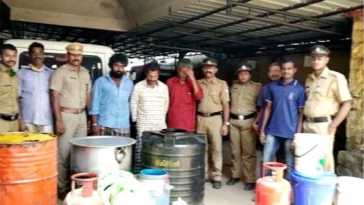Police seized 13 liters of country liquor and equipments Police seized 13 liters of country liquor and equipments