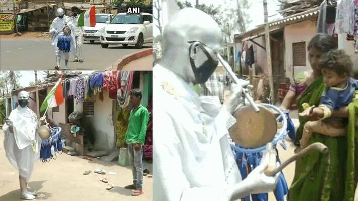 man dressed as gandhi ji distributes masks and sanitizers man dressed as gandhi ji distributes masks and sanitizers