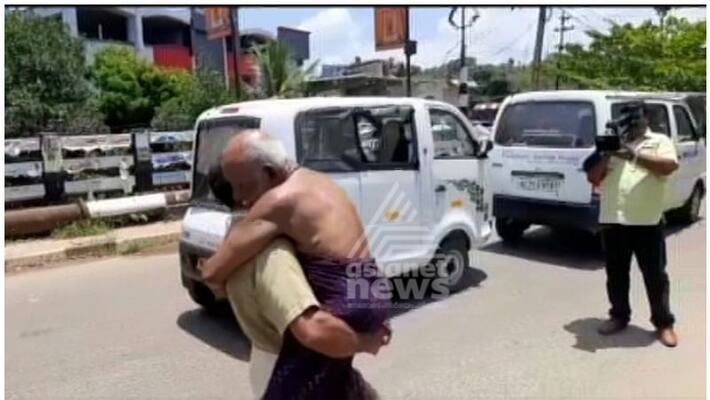 Covid 19 Kollam man forced to carry sick father to vehicle due to restrictions Covid 19 Kollam man forced to carry sick father to vehicle due to restrictions