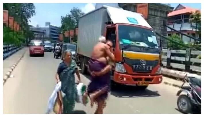 Kerala man carries ailing father on shoulders after police stop vehicle over lockdown Kerala man carries ailing father on shoulders after police stop vehicle over lockdown