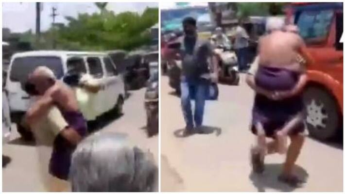 A person carried his 65-year-old ailing father in Punalur and walked close to one kilometre A person carried his 65-year-old ailing father in Punalur and walked close to one kilometre