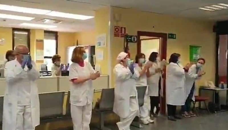 Coronavirus Spanish cab driver gets standing ovation surprise cheque from doctors video