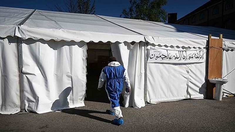 A member of staff enters the temporary mortuary which was constructed three weeks ago.