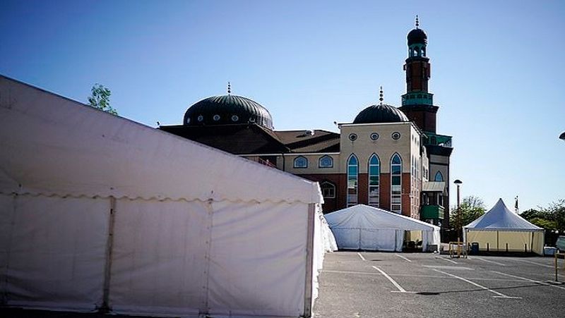 In a devastated state, the car park outside the Central Jamia Mosque Ghamkol Sharif in Birmingham has turned into a temporary mortuary.