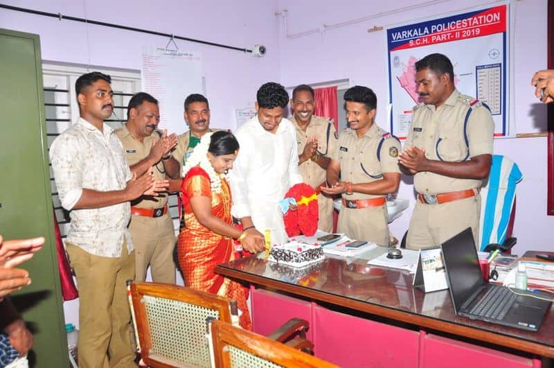 Newly wedded couple serving food to police officers