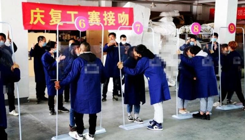 While world suffers from coronavirus spread, China organises kissing competition as part of factory reopening