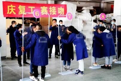 While world suffers from coronavirus spread, China organises kissing competition as part of factory reopening