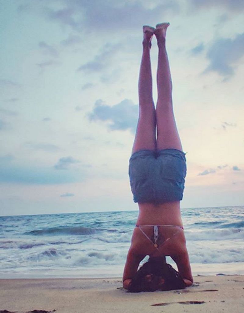 Amala Paul's pictures of her on the beach performing yoga poses has gone viral