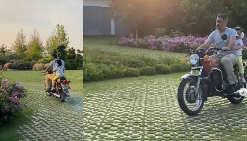 dhoni and her daughter ziva bike rounds in home video goes viral in social medias