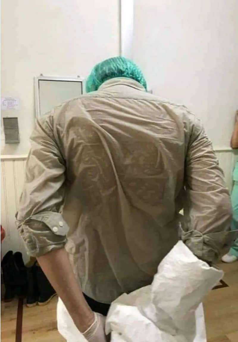 doctors removing his ppe after his 6 hours duty in hospital