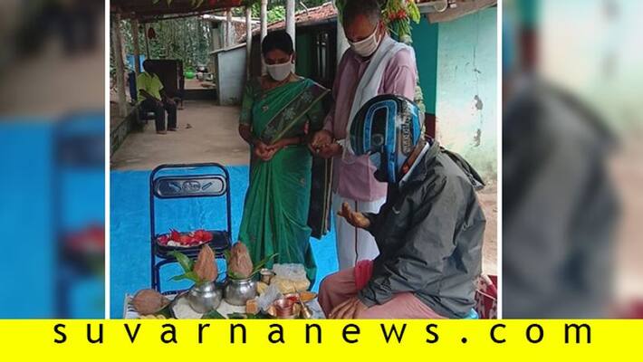 Priest did not Remove Mask Helmet without Complete Marriage in Beluru in Hassan District Priest did not Remove Mask Helmet without Complete Marriage in Beluru in Hassan District