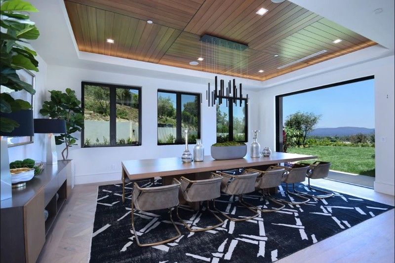 This house is spread across 3 acres with a stunning view of a valley and is situated at serene location. The living room is divided into several areas and consists of a long dining table and spacious sofa that is large enough to accommodate the entire Jonas clan.
