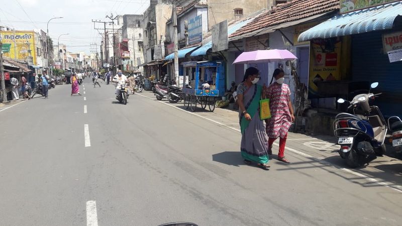 கொரோனா அச்சம் நடுவே... முகத்தில் மாஸ்க்கோடு வெளியே வந்த மக்கள்