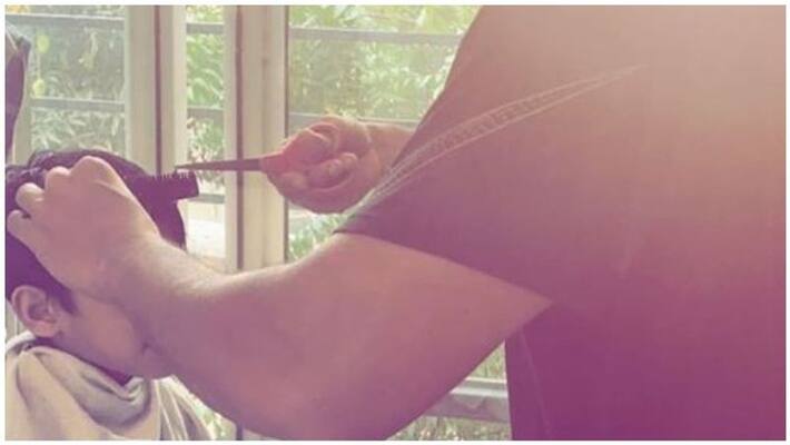 actor jayam ravi hair cut him children photo goes viral in social media actor jayam ravi hair cut him children photo goes viral in social media