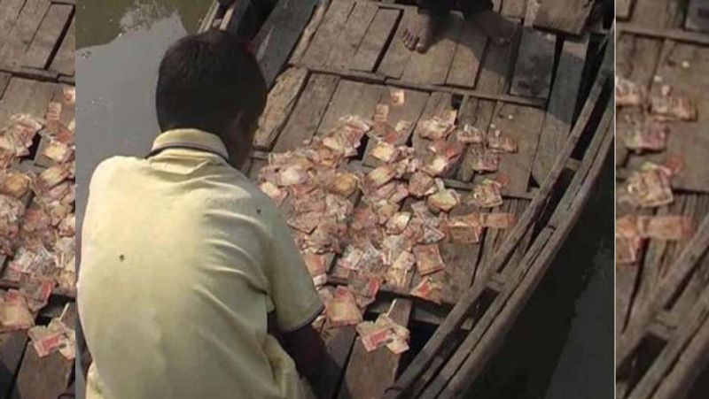 coronavirus news madhya pradesh bag filled with 500 and 2000 notes found in pond in khandwa kpr