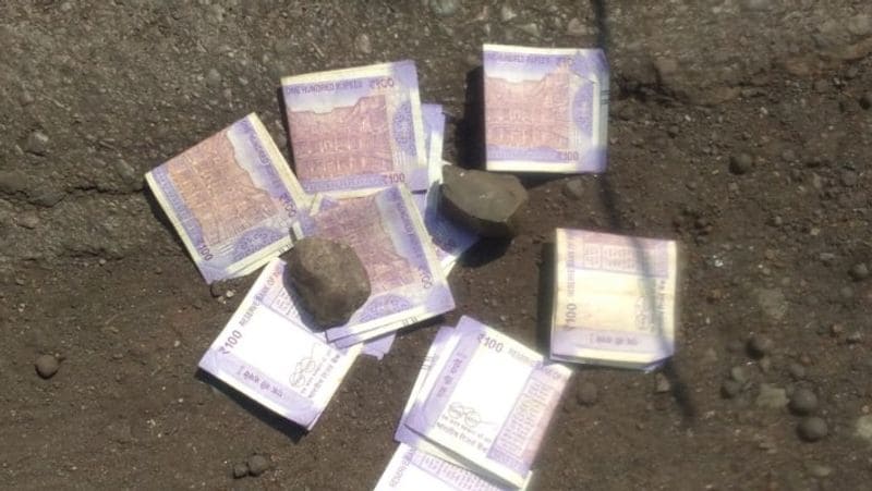 coronavirus news madhya pradesh bag filled with 500 and 2000 notes found in pond in khandwa kpr