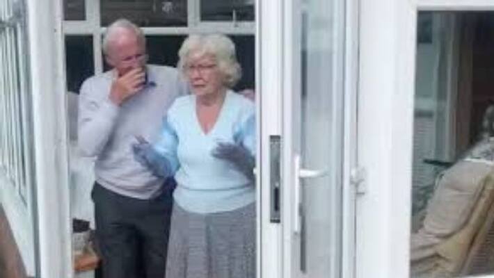 Man makes cuddle curtain to hug granny amid covid 19 Man makes cuddle curtain to hug granny amid covid 19