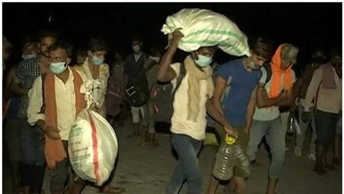 Hundreds of migrant workers crossing the Yamuna river on foot at night from Haryana to go home in Bihar Hundreds of migrant workers crossing the Yamuna river on foot at night from Haryana to go home in Bihar
