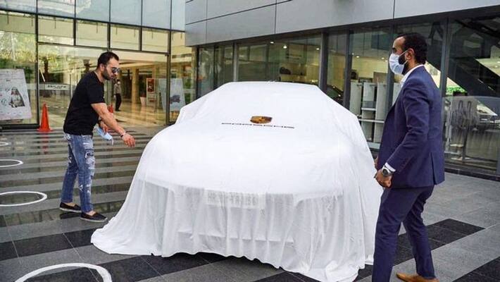 Virat Kohlis brother takes delivery of Panamera Turbo as Porsche resume dealership operations Virat Kohlis brother takes delivery of Panamera Turbo as Porsche resume dealership operations
