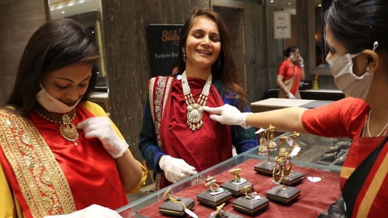 Gold silver shine, dollar slows down before Dhanteras