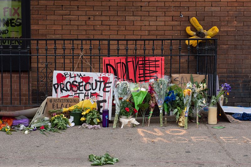 Flowers and banners are laid in the memory of George Floyd outside of Cup Foods on May 29 in Minnesota, Minneapolis.