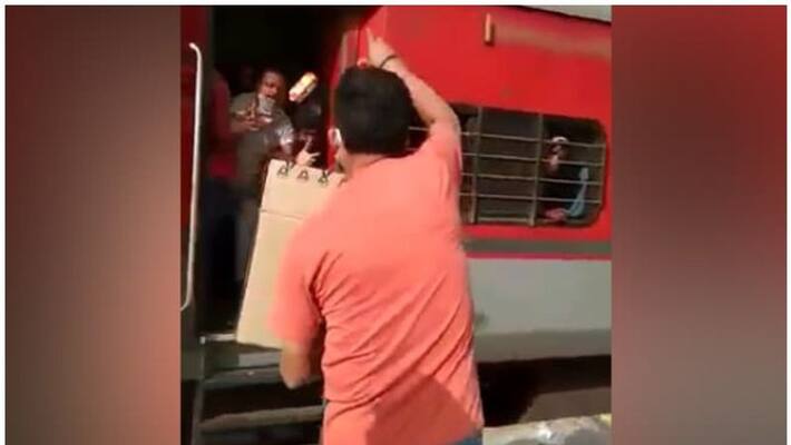 railway officer suspended for throwing biscuits to migrants railway officer suspended for throwing biscuits to migrants