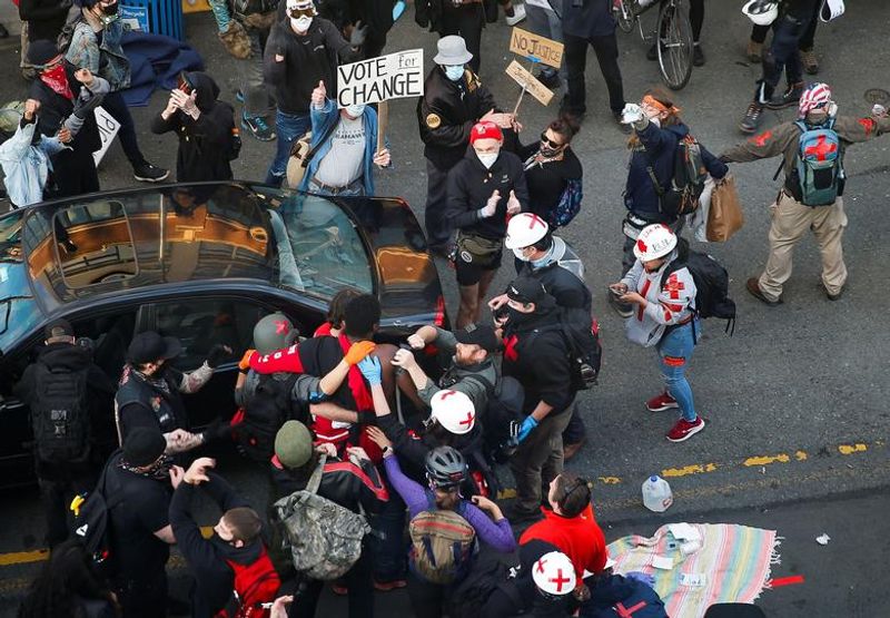 man shot at protest by a car driver