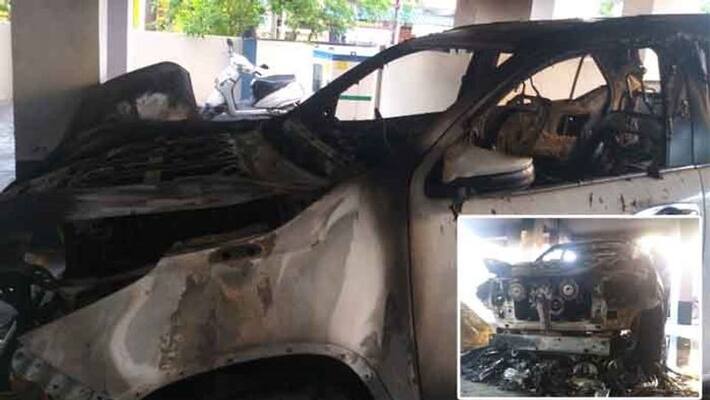 Fire outbreaks in parking car at Karimanagar Fire outbreaks in parking car at Karimanagar