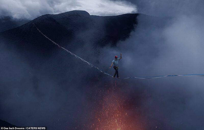 Two men created history by walking above a volcano on a rope