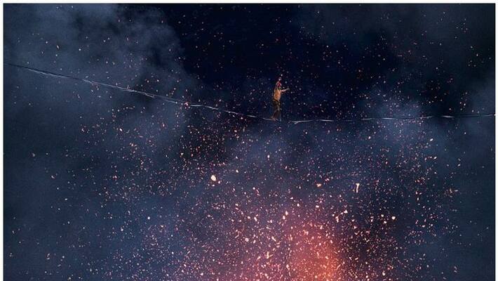 Two men created history by walking above a volcano on a rope Two men created history by walking above a volcano on a rope