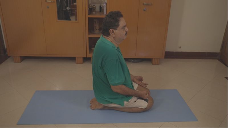 B Ramanath Rai performs Yoga day in his native house