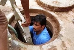 Karnataka BJP corporator shows how its done gets into manhole to unclog it