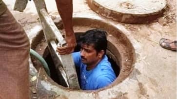 Karnataka BJP corporator shows how its done gets into manhole to unclog it