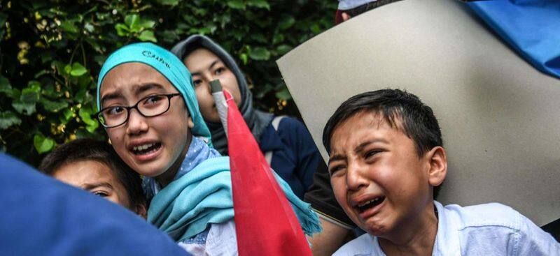 china harassing Uighur Muslim ladys in refugee champ