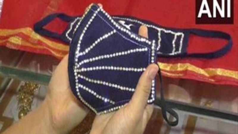 gujarat news diamonds attach with masks selling for 5 lakh each in jeweller kpr