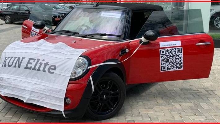 Coronavirus effect Mini cooper car wear mask to promote sales Coronavirus effect Mini cooper car wear mask to promote sales