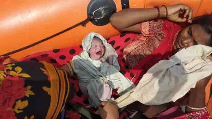 25 year old woman delivers baby girl on ndrf boat in flood hit bihar 25 year old woman delivers baby girl on ndrf boat in flood hit bihar