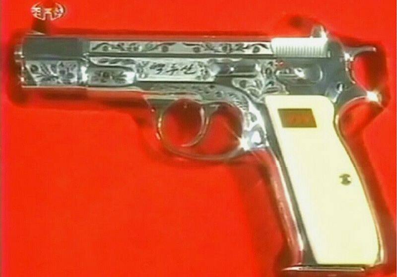 kim jong un gifts his generals with special hand guns to celebrate war anniversary