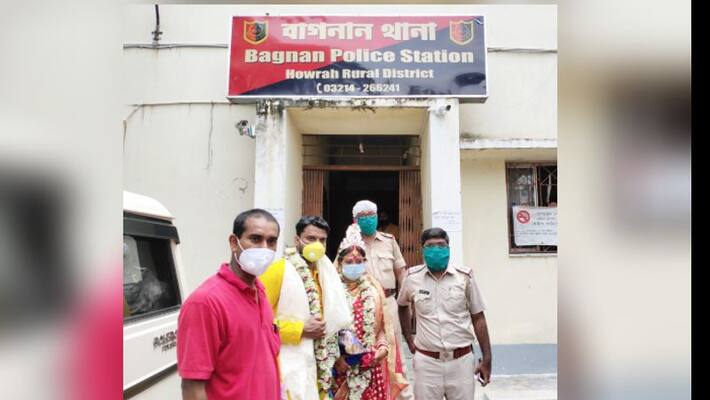 Newly wed couple serve sweet amond policemen in Bagnan police station Newly wed couple serve sweet amond policemen in Bagnan police station