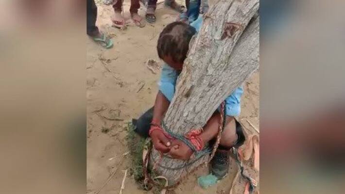 rajasthan news tied to young man tree and beaten up made to drink urine in barmer kpr rajasthan news tied to young man tree and beaten up made to drink urine in barmer kpr
