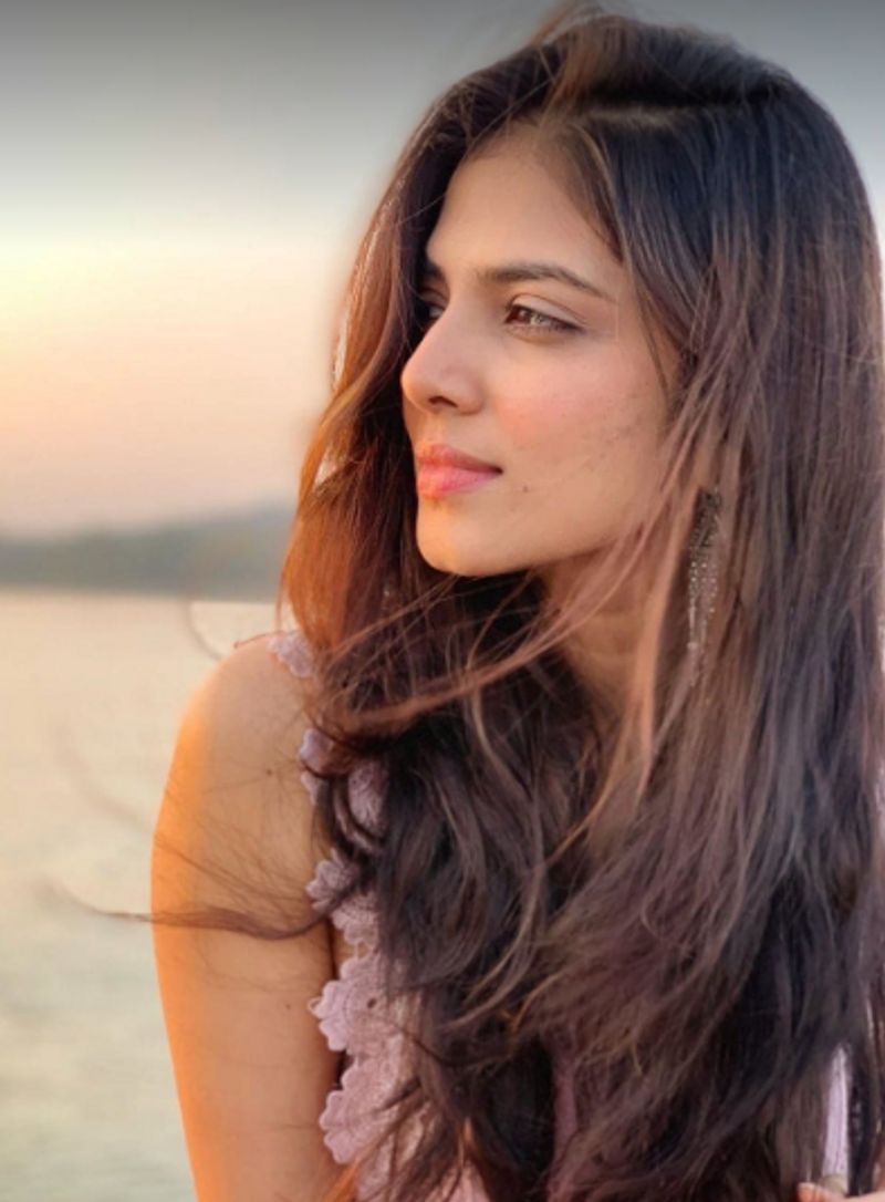 malavika mohan latest hot pose for pink color dress