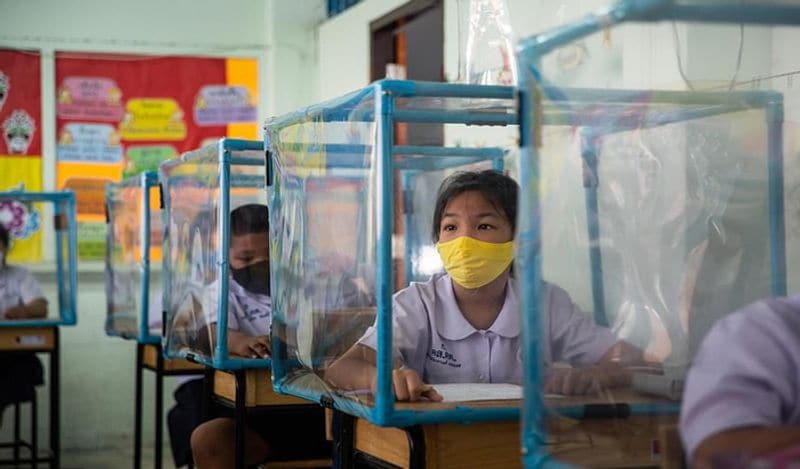 Schools opened in thailand between Corona with most strictest social distancing rules children locked in cages and taking classes like this kph