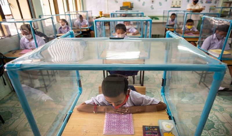 Schools opened in thailand between Corona with most strictest social distancing rules children locked in cages and taking classes like this kph