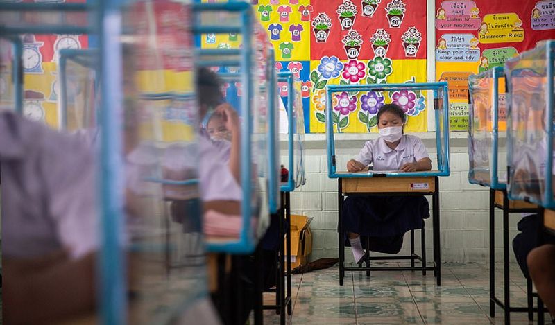 Schools opened in thailand between Corona with most strictest social distancing rules children locked in cages and taking classes like this kph