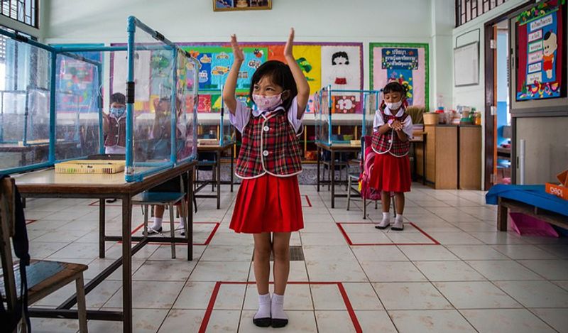Schools opened in thailand between Corona with most strictest social distancing rules children locked in cages and taking classes like this kph