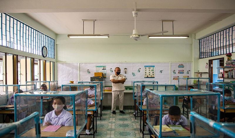 Schools opened in thailand between Corona with most strictest social distancing rules children locked in cages and taking classes like this kph