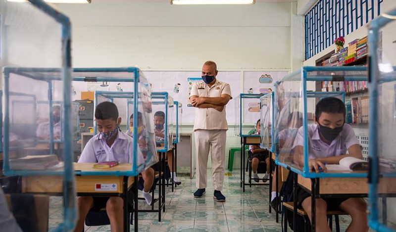 Schools opened in thailand between Corona with most strictest social distancing rules children locked in cages and taking classes like this kph