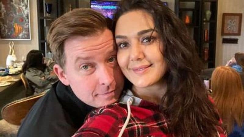 Preity Zinta cuts husband gene goodenough hair professionaly