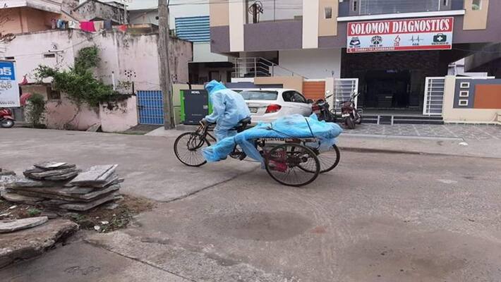 Covid19 dead body carried to rickshaw in bapatla Covid19 dead body carried to rickshaw in bapatla