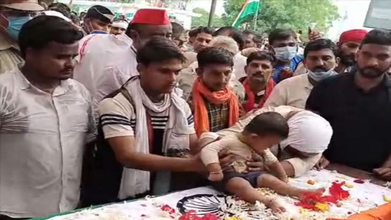 Pulwama martyr body wrapped in tricolor reached home everyone cried after seeing 7 month old son near body kpl